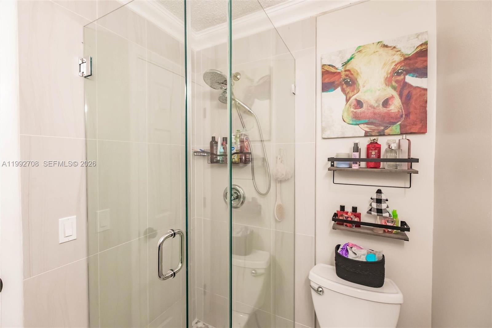 9404 Southwest 8th Terrace, Unit 9404 Miami, FL 33174 - Photo 26 of 41 a bathroom with a shower and a sink