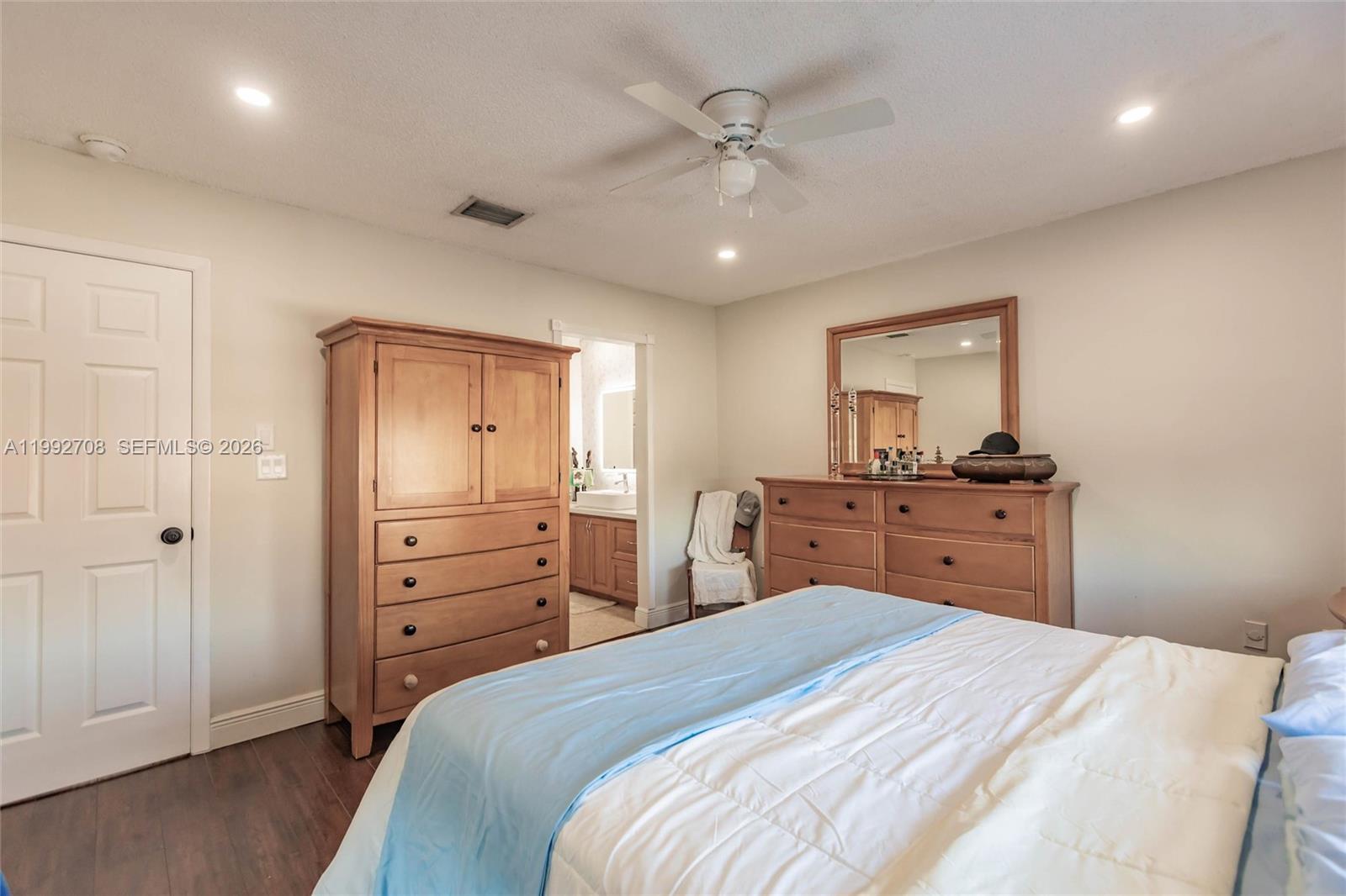 9404 Southwest 8th Terrace, Unit 9404 Miami, FL 33174 - Photo 30 of 41 a bedroom with a bed and a dresser