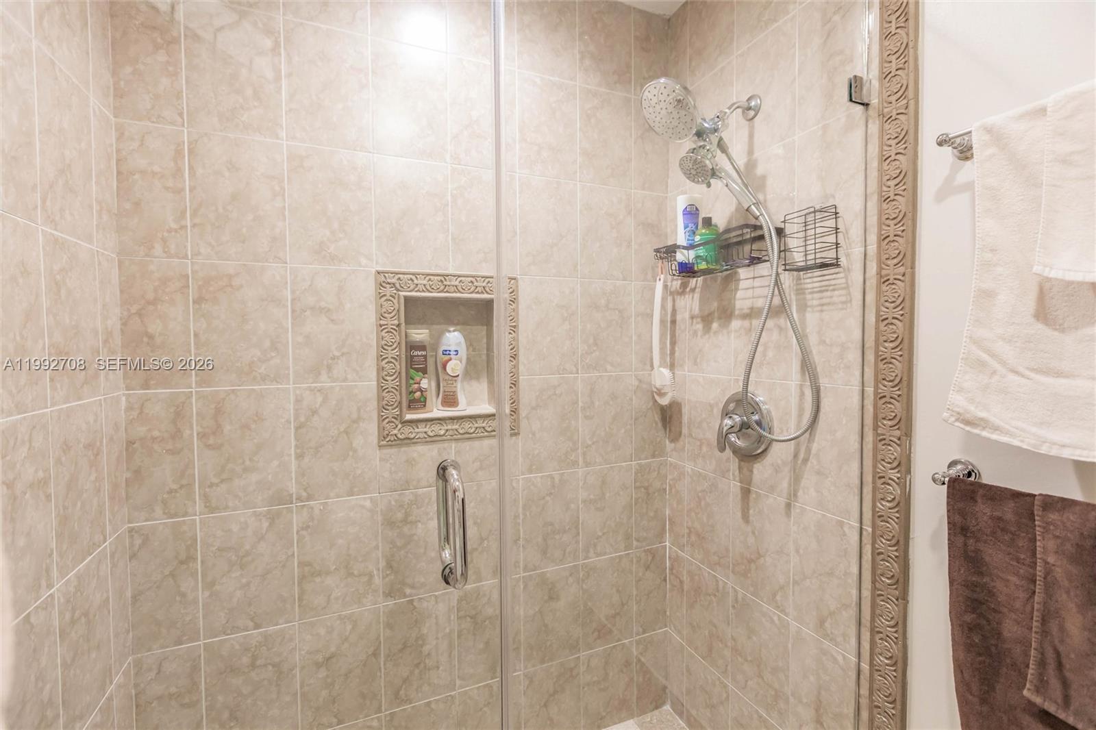 9404 Southwest 8th Terrace, Unit 9404 Miami, FL 33174 - Photo 35 of 41 a bathroom with a shower