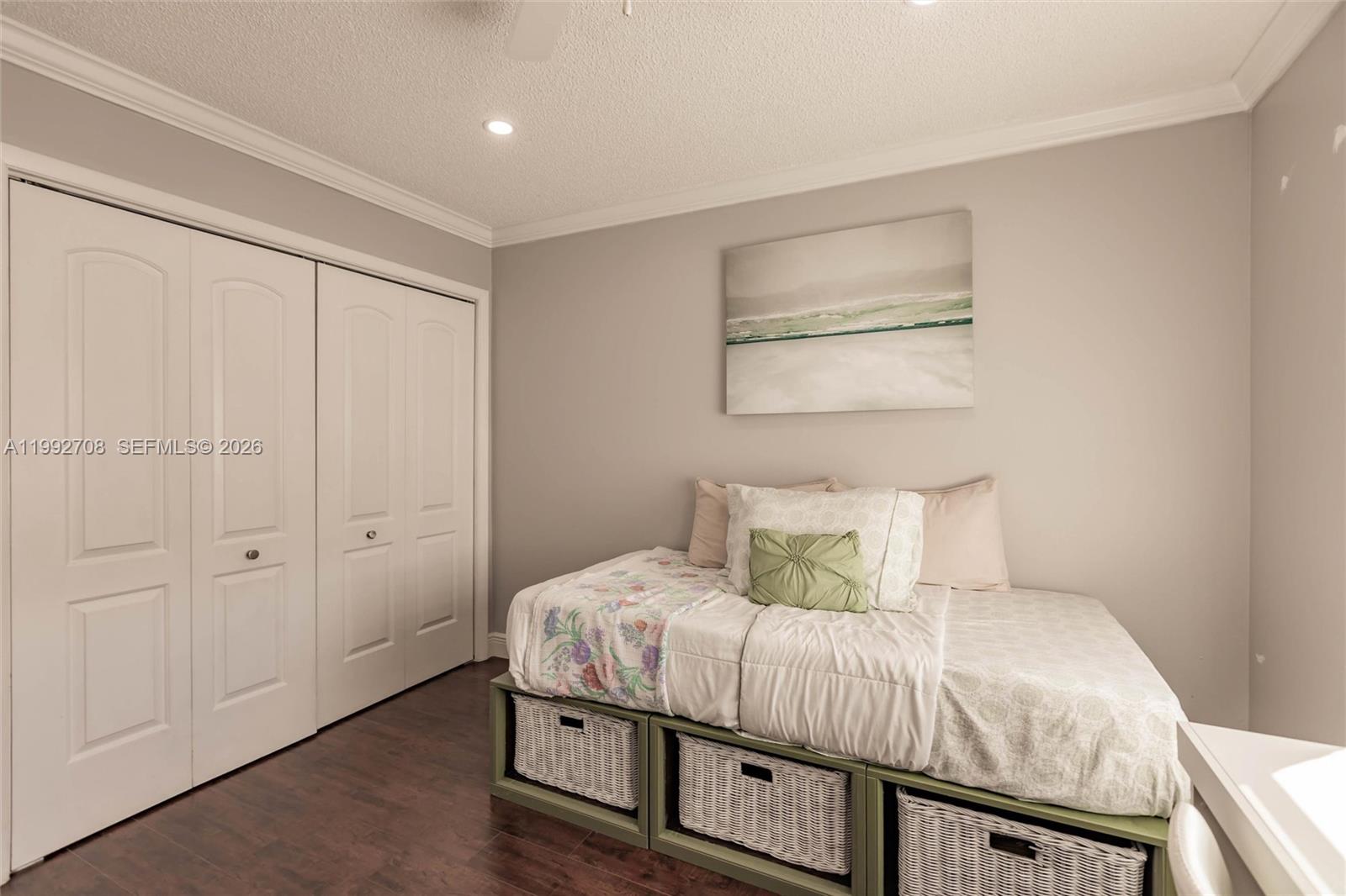 9404 Southwest 8th Terrace, Unit 9404 Miami, FL 33174 - Photo 36 of 41 a bedroom with a bed and a painting on the wall