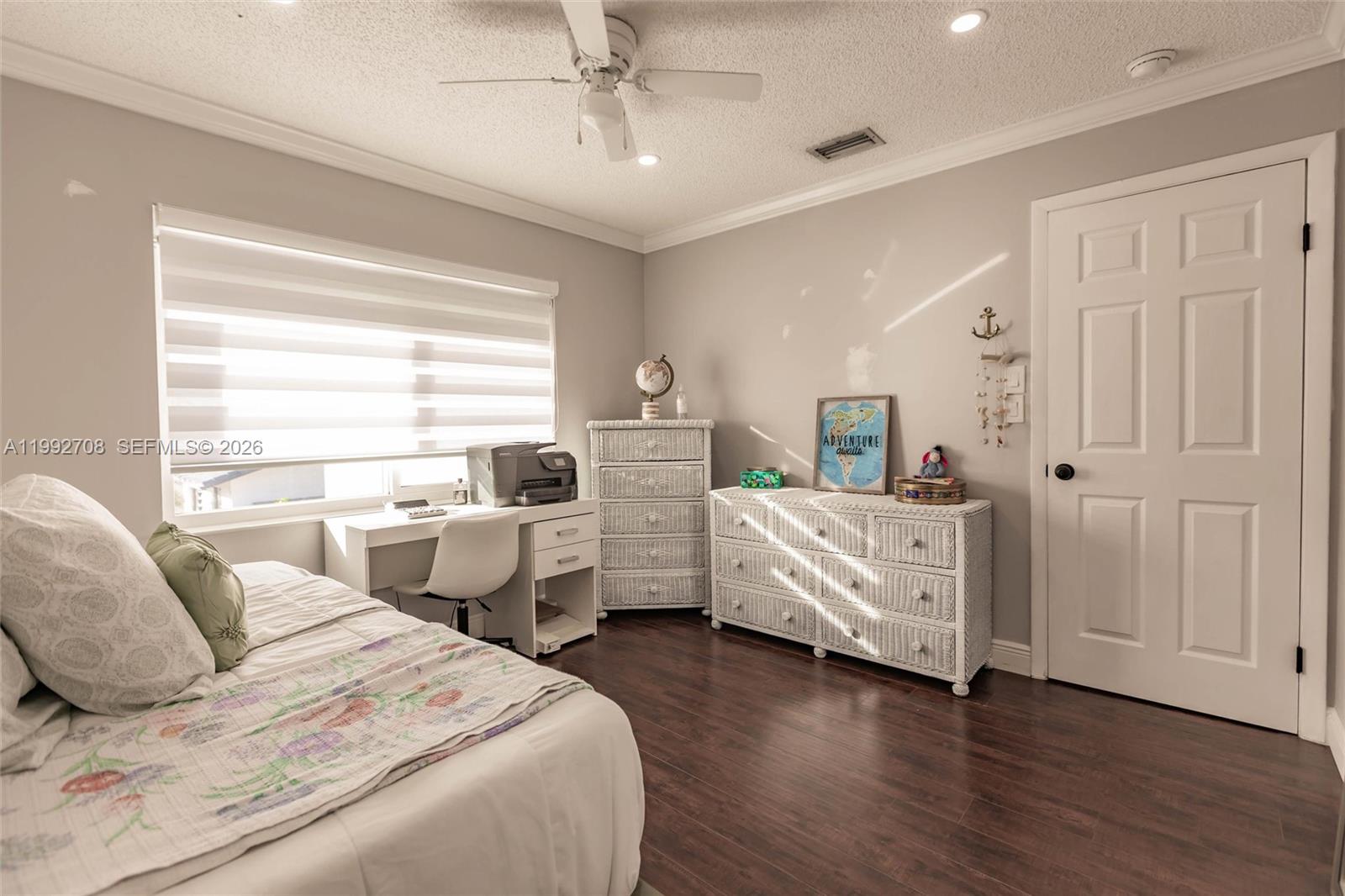 9404 Southwest 8th Terrace, Unit 9404 Miami, FL 33174 - Photo 37 of 41 a bedroom with furniture and window