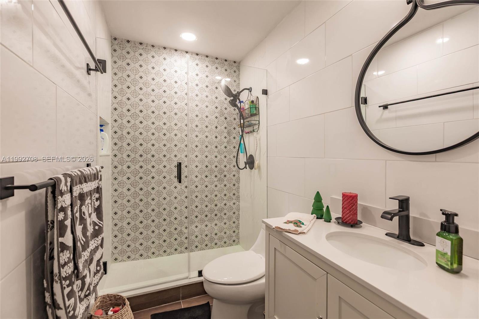 9404 Southwest 8th Terrace, Unit 9404 Miami, FL 33174 - Photo 38 of 41 a bathroom with a sink toilet and shower