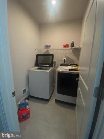 a utility room with washer and dryer