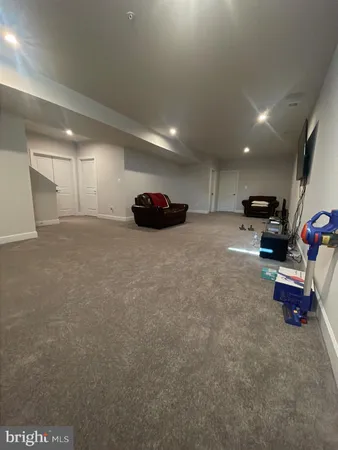 a view of a room with gym equipment and windows