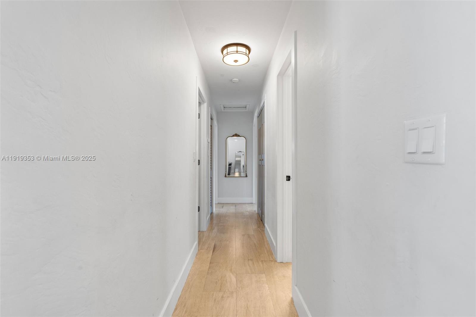 9920 Southwest 35th Terrace Miami, FL 33165 - Photo 13 of 32 a view of a hallway with wooden floor