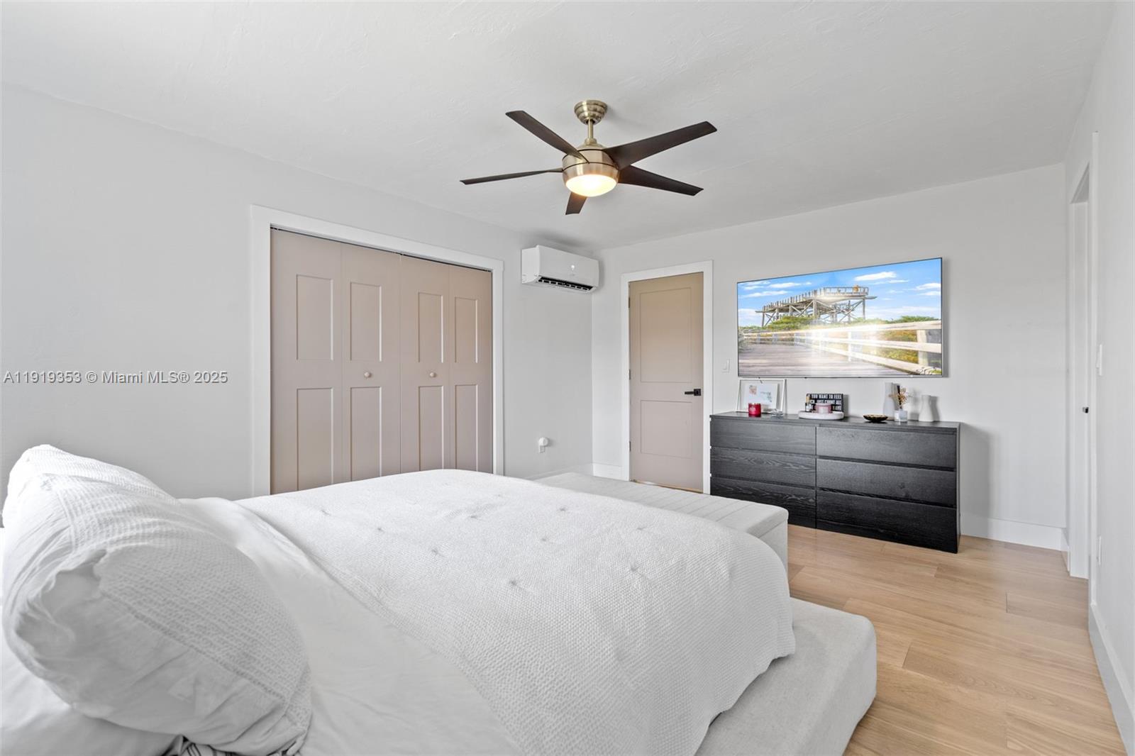 9920 Southwest 35th Terrace Miami, FL 33165 - Photo 16 of 32 a large bedroom with a bed and a chandelier