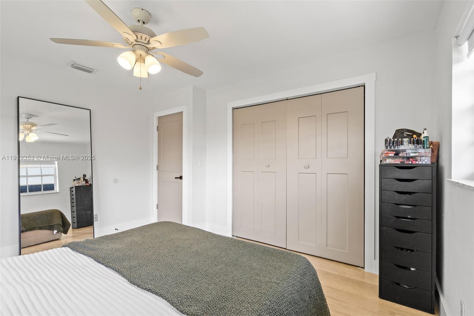 9920 Southwest 35th Terrace Miami, FL 33165 - Photo 20 of 32 a bedroom with a bed and a chandelier