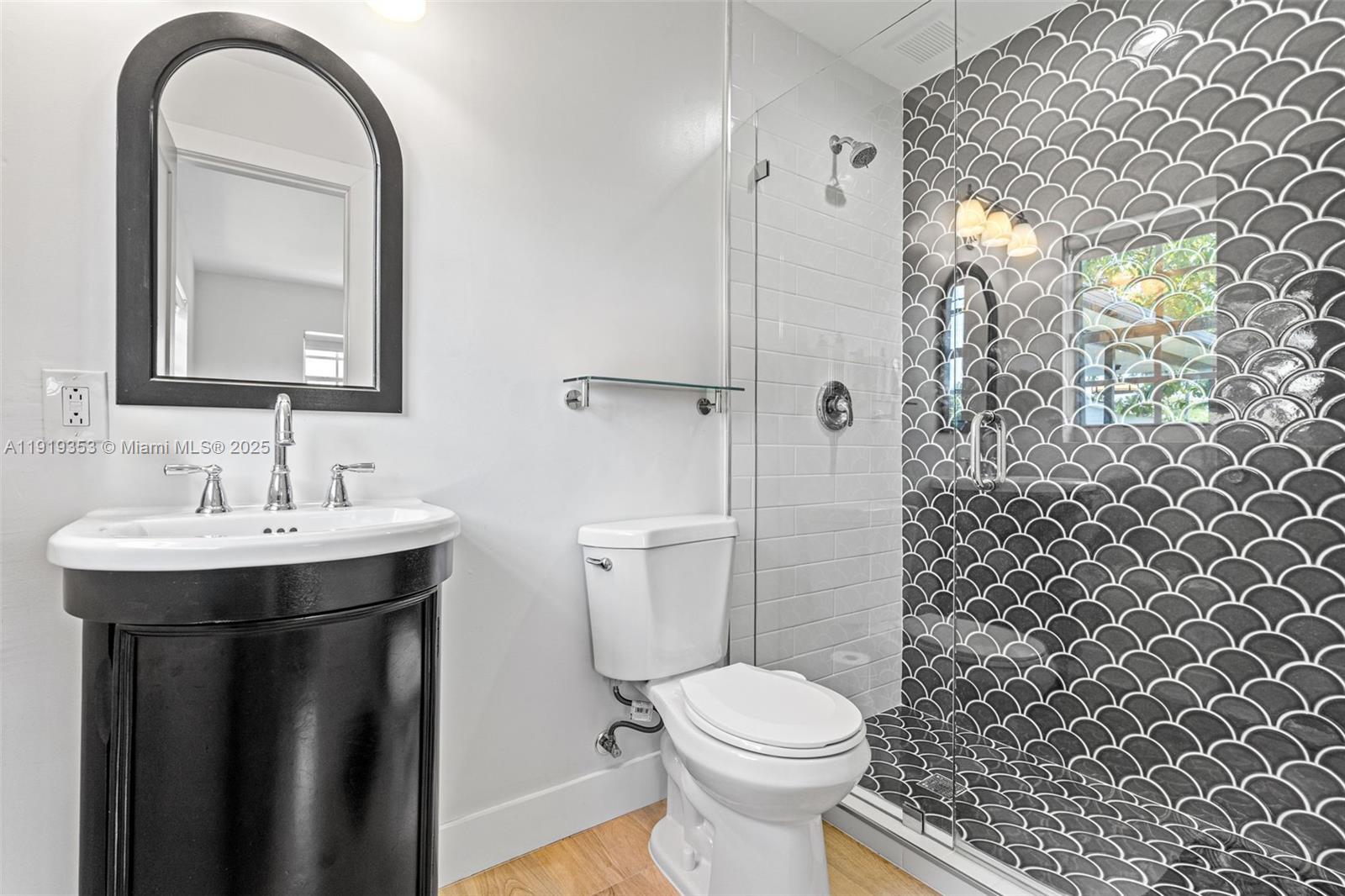 9920 Southwest 35th Terrace Miami, FL 33165 - Photo 21 of 32 a bathroom with a sink toilet and shower