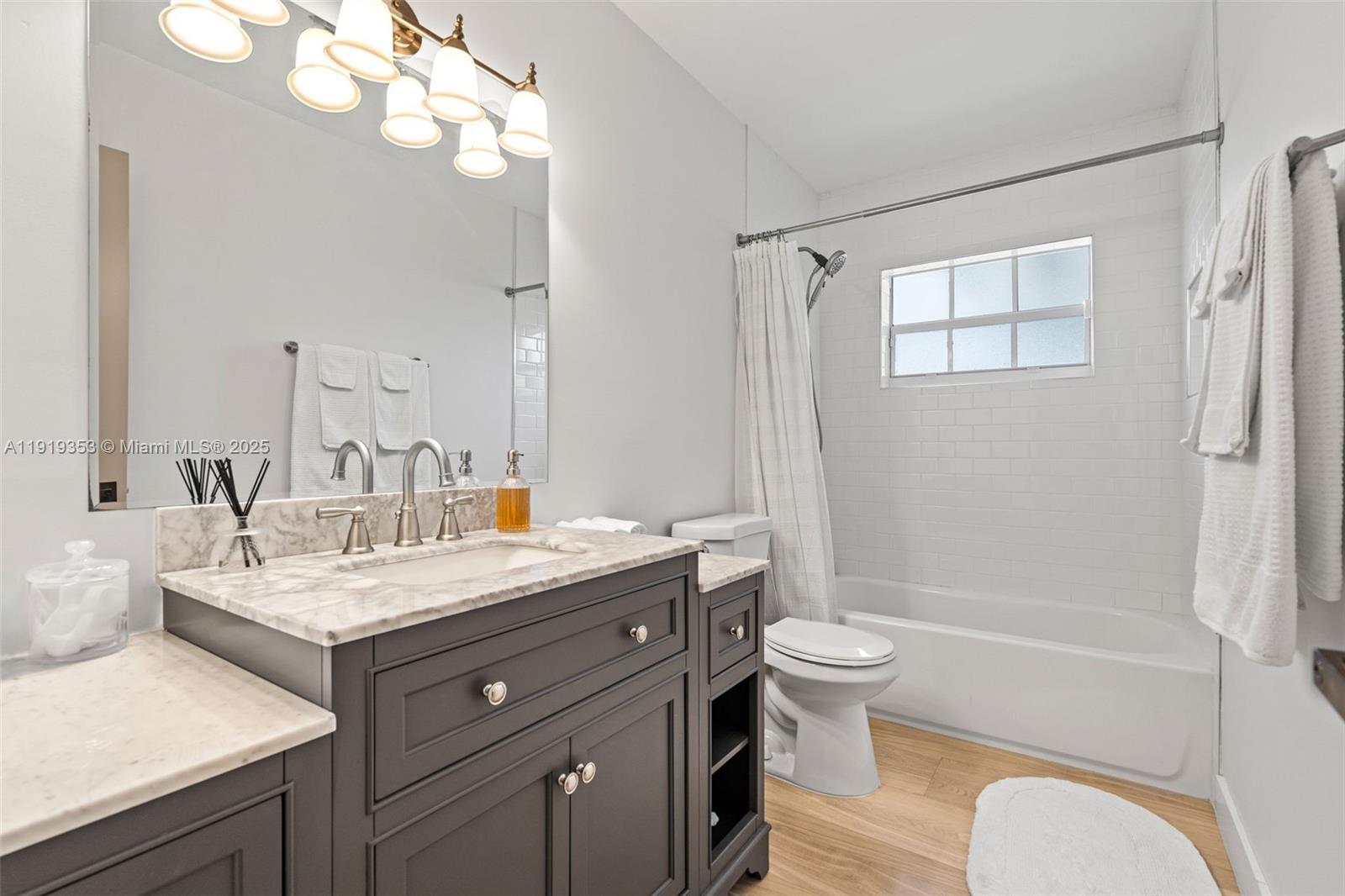 9920 Southwest 35th Terrace Miami, FL 33165 - Photo 24 of 32 a bathroom with a granite countertop sink toilet and shower