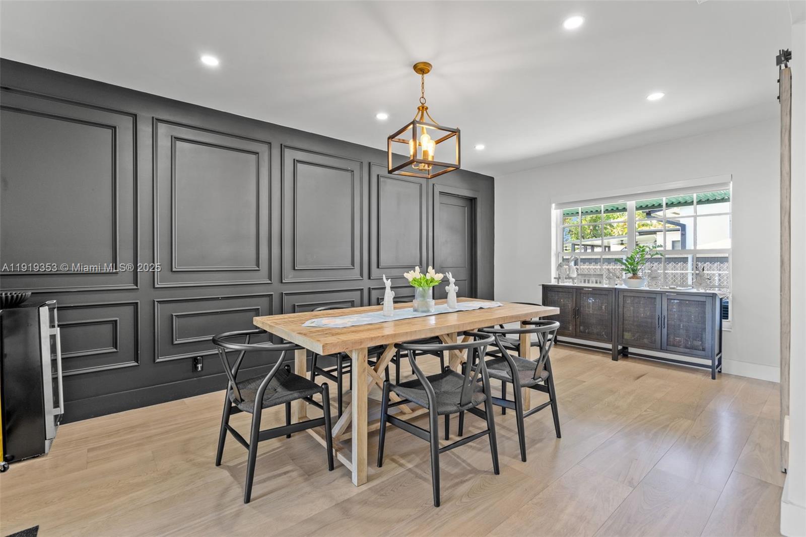 9920 Southwest 35th Terrace Miami, FL 33165 - Photo 9 of 32 a dining room with furniture a chandelier and wooden floor