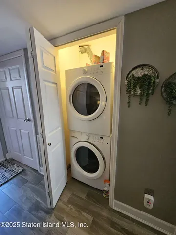 a close view of a utility room with dryer and washer