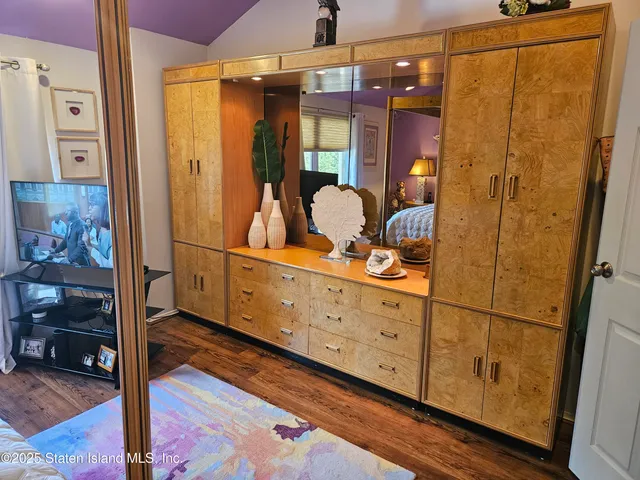 a bathroom with a mirror and a shower