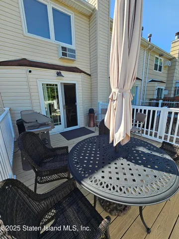a view of a balcony with furniture