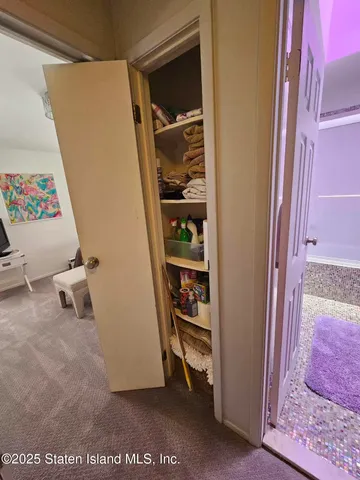 a view of a street with cars parked