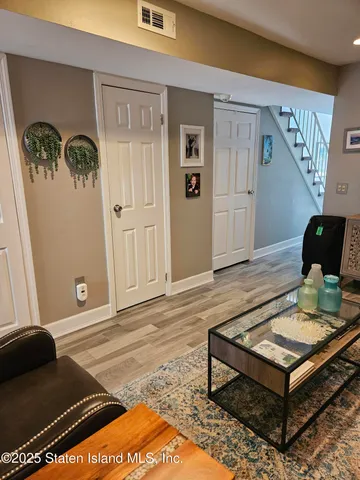 a living room with furniture and a rug