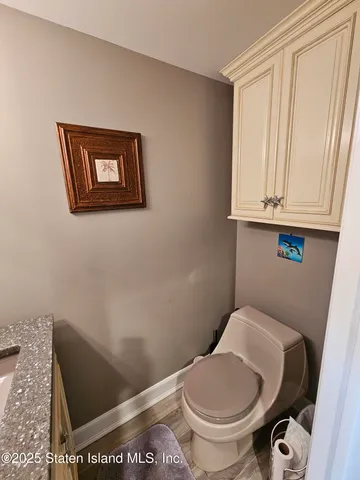 a bathroom with a toilet and a sink
