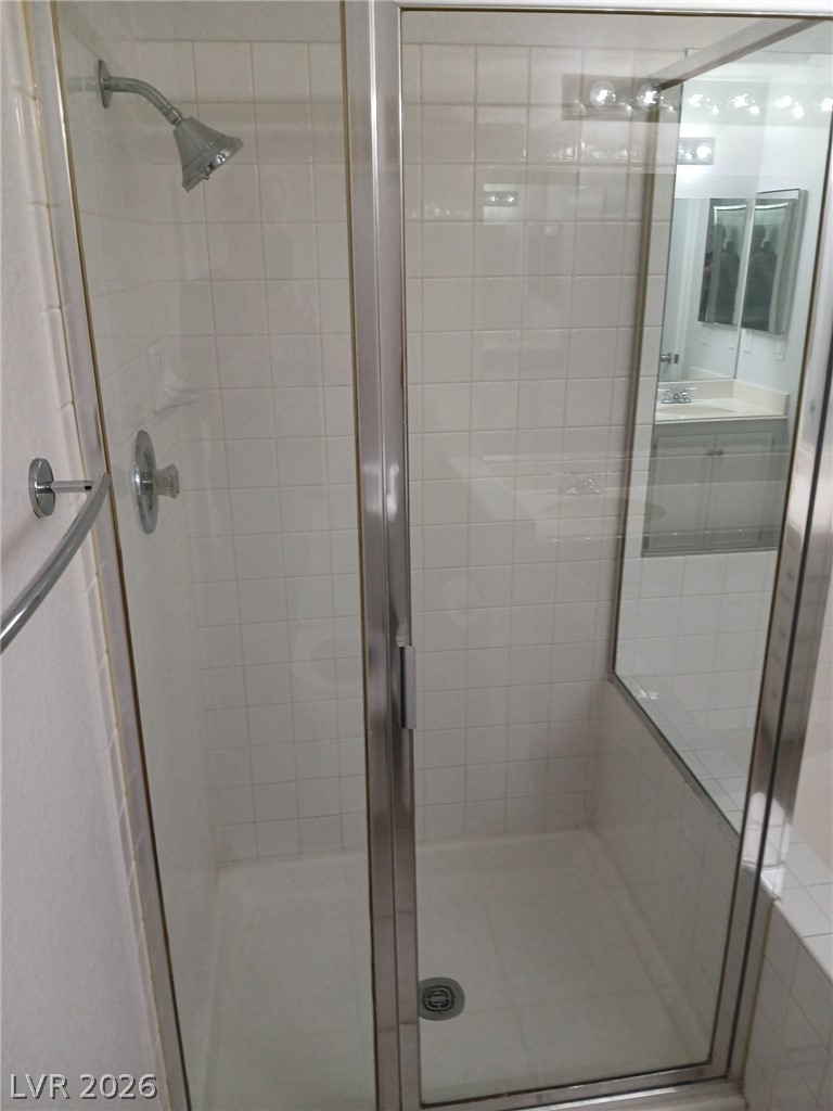 2201 Ramsgate Drive, Unit 426 Henderson, NV 89074 - Photo 19 of 22 This bathroom features a sleek glass-enclosed shower with tile flooring.