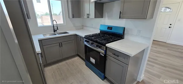 a kitchen with a sink stove and cabinets