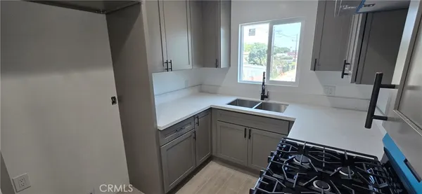 a kitchen with a sink and a window