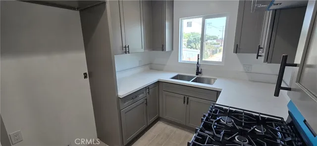 a kitchen with a sink and a window