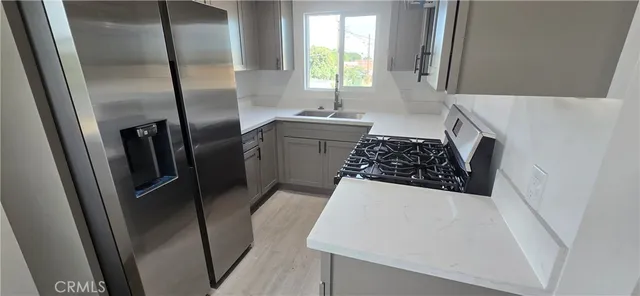 a view of hallway with a fireplace and a window