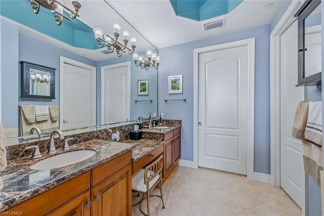 a bathroom with a tub a sink and a shower