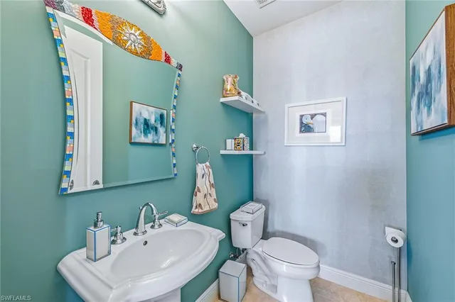 a utility room with sink dryer and washer