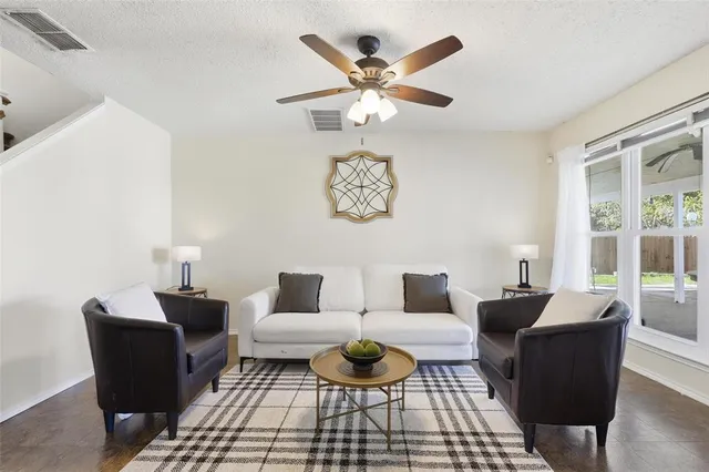 a living room with furniture and a window