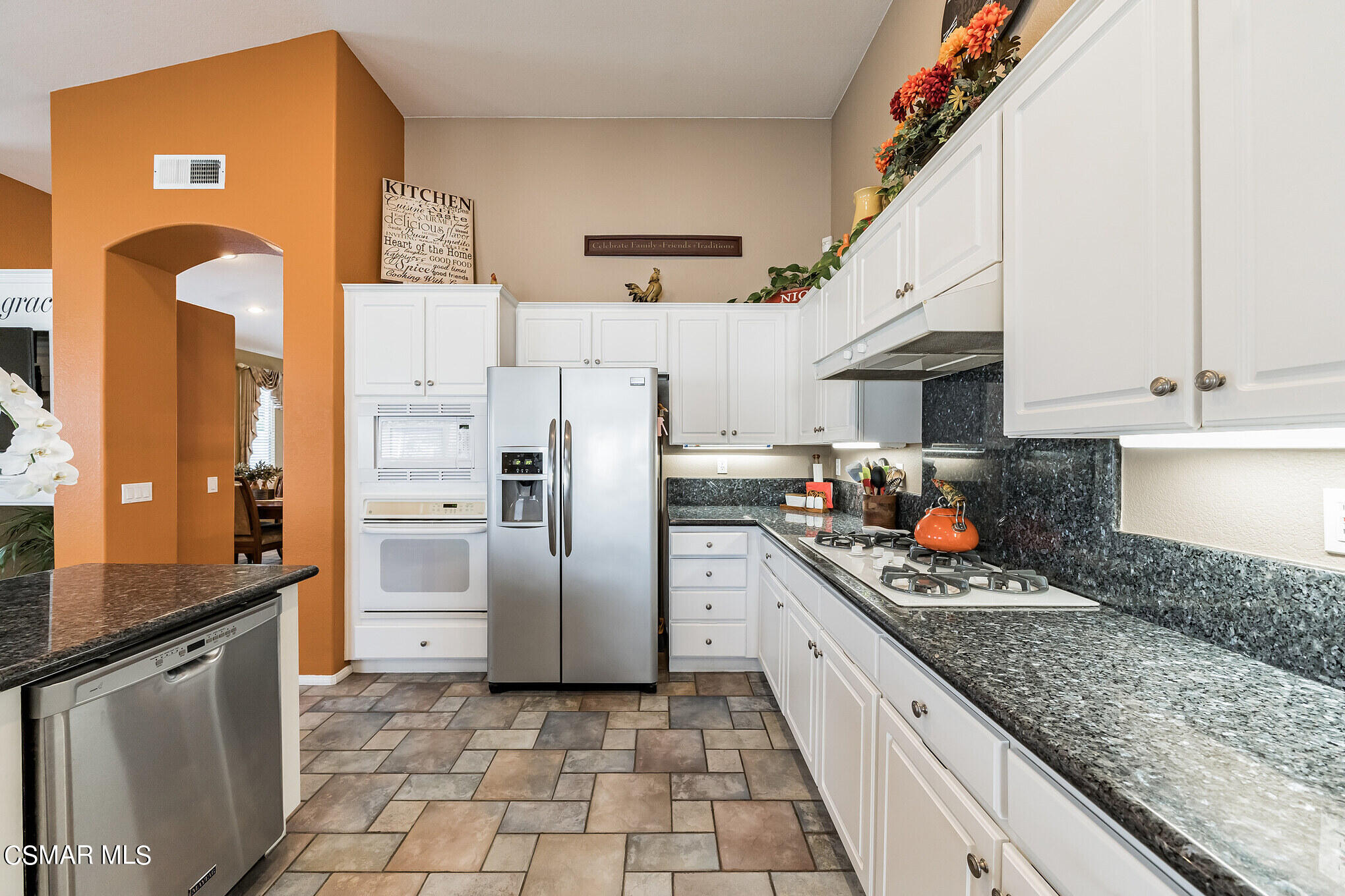 1990 Winterdew Avenue Simi Valley, CA 93065 - Photo 12 of 38 a kitchen with stainless steel appliances granite countertop a refrigerator a stove and a sink