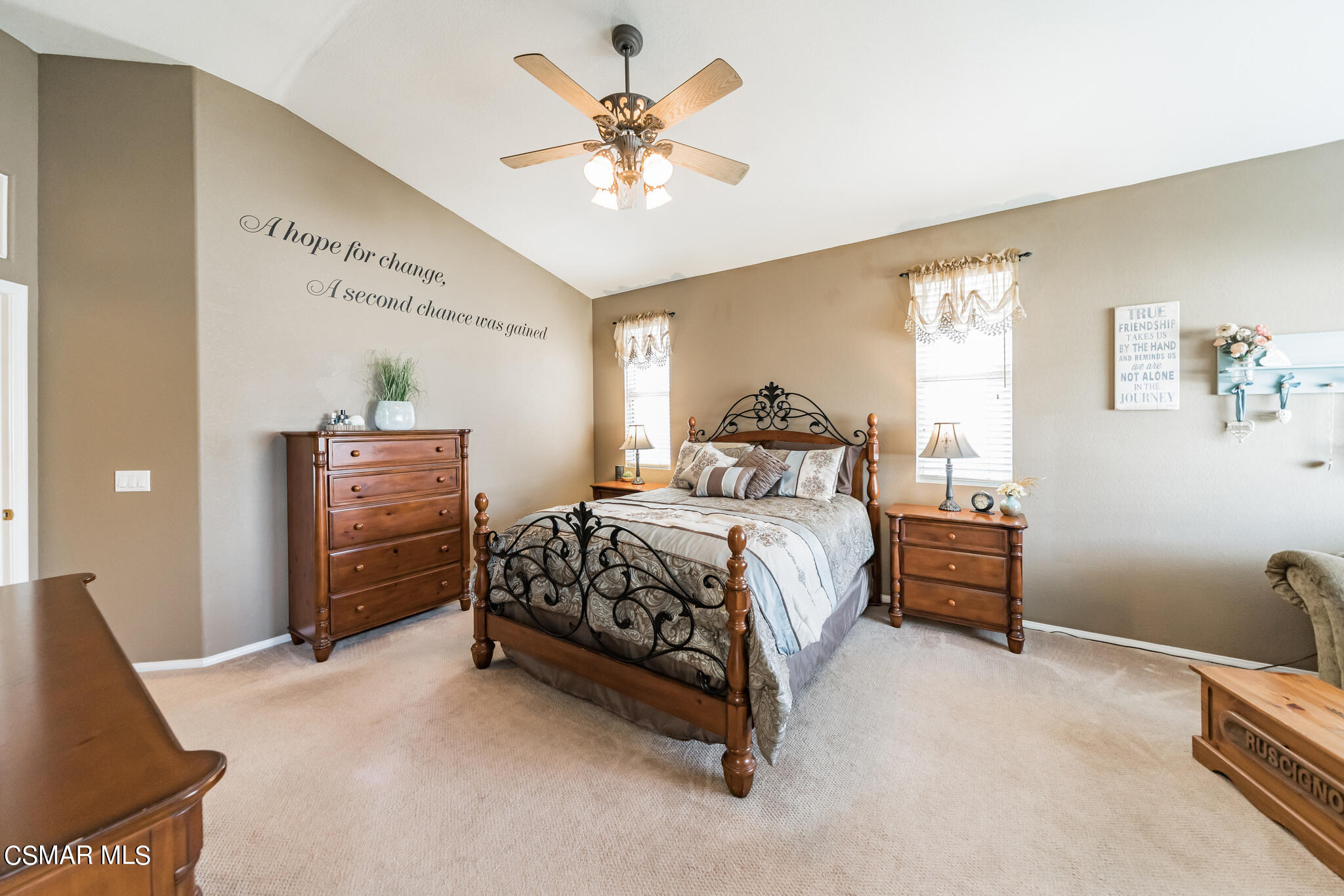 1990 Winterdew Avenue Simi Valley, CA 93065 - Photo 21 of 38 a bedroom with a bed and a chandelier