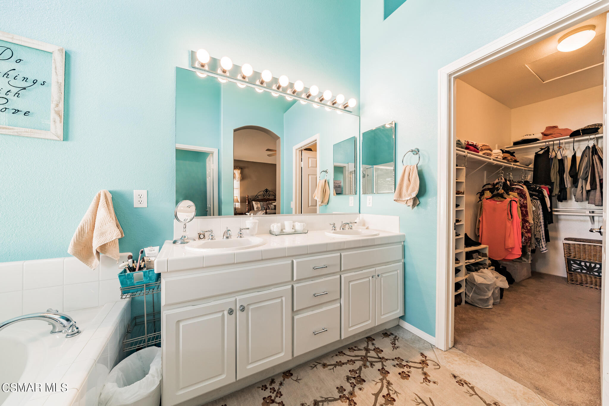 1990 Winterdew Avenue Simi Valley, CA 93065 - Photo 24 of 38 a bathroom with a double vanity sink and a mirror