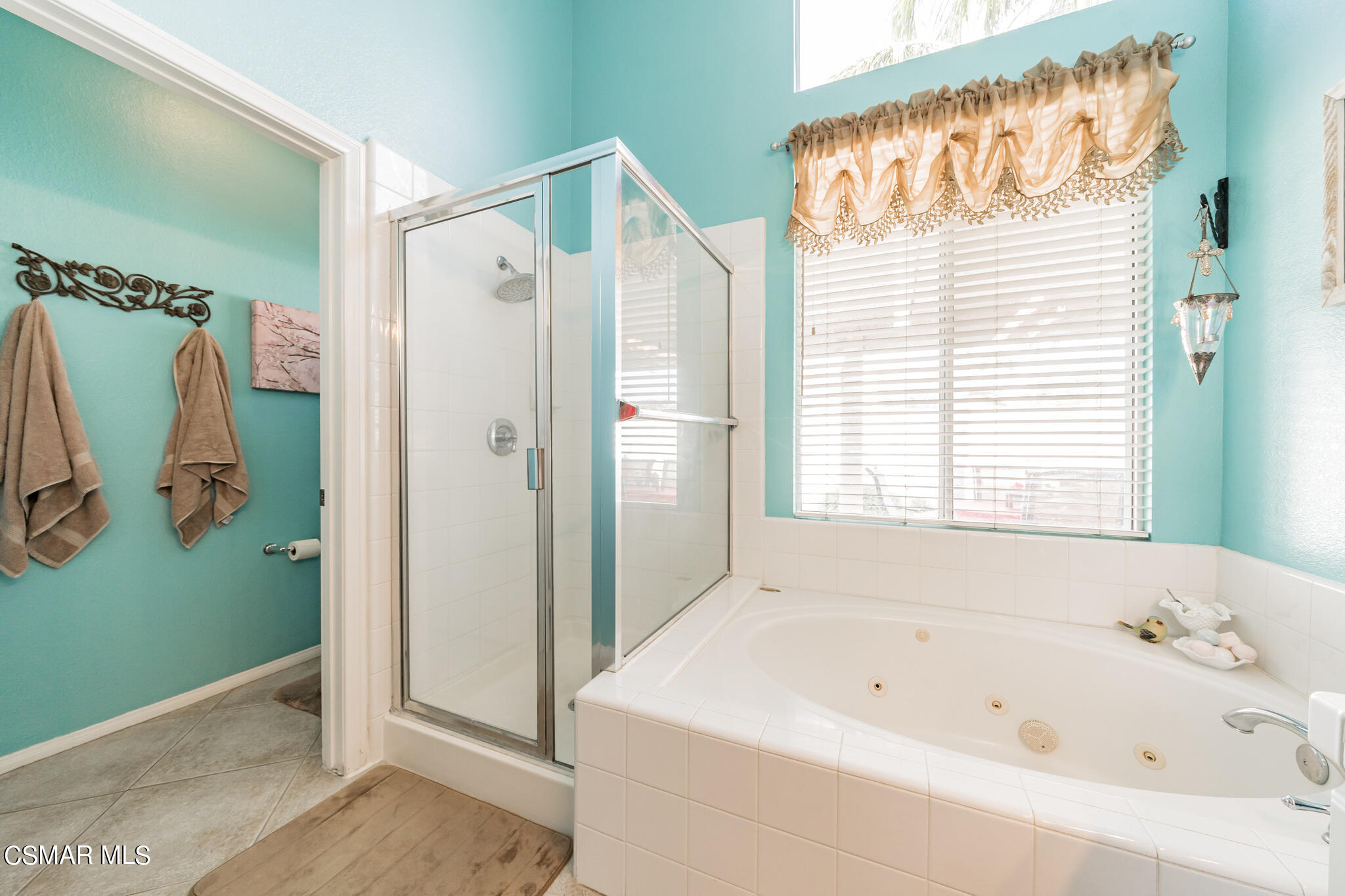 1990 Winterdew Avenue Simi Valley, CA 93065 - Photo 25 of 38 a bathroom with a bathtub and a shower