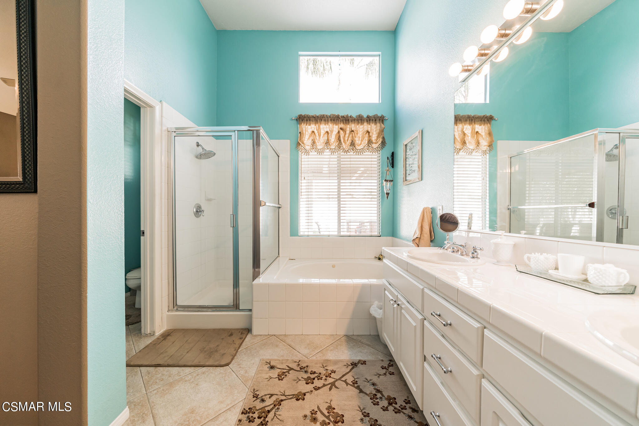 1990 Winterdew Avenue Simi Valley, CA 93065 - Photo 26 of 38 a spacious bathroom with a tub sink and mirror