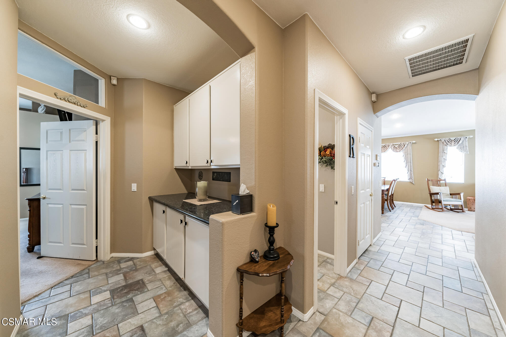 1990 Winterdew Avenue Simi Valley, CA 93065 - Photo 27 of 38 a hallway with a sink and a window