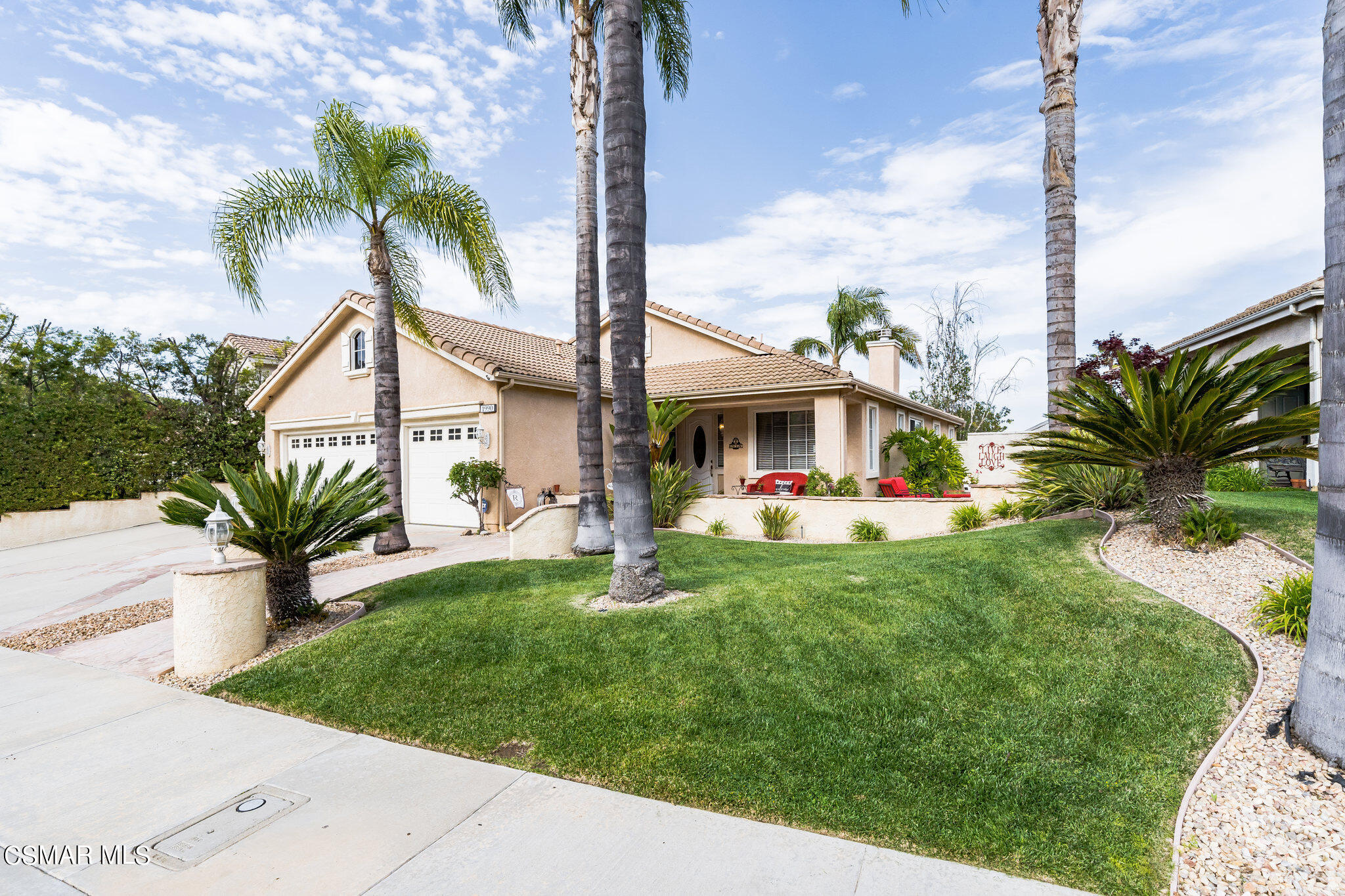 1990 Winterdew Avenue Simi Valley, CA 93065 - Photo 3 of 38 a front view of a house with a garden