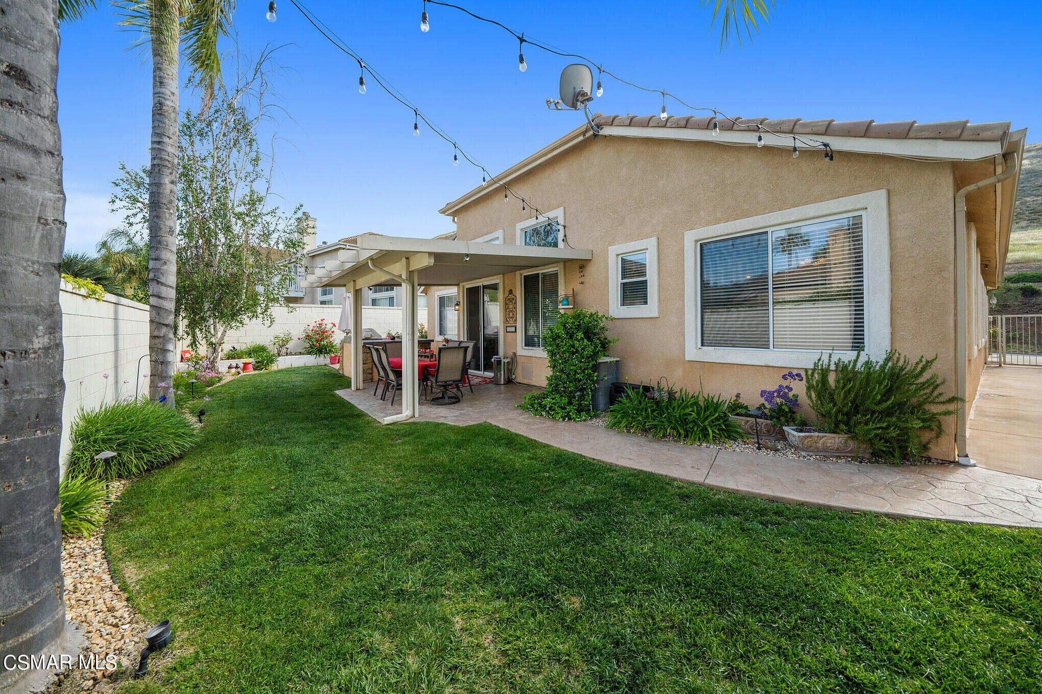 1990 Winterdew Avenue Simi Valley, CA 93065 - Photo 32 of 38 a view of a house with a yard
