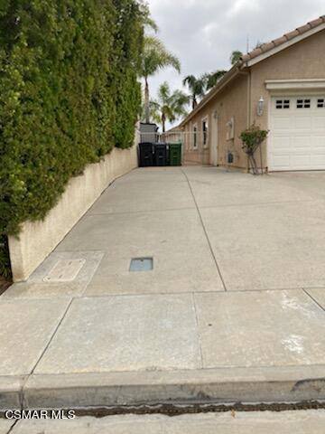 1990 Winterdew Avenue Simi Valley, CA 93065 - Photo 35 of 38 a view of a house with a outdoor space
