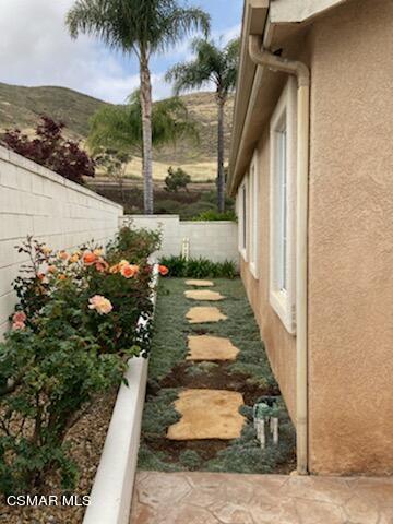 1990 Winterdew Avenue Simi Valley, CA 93065 - Photo 36 of 38 a view of a pathway of a house with a yard