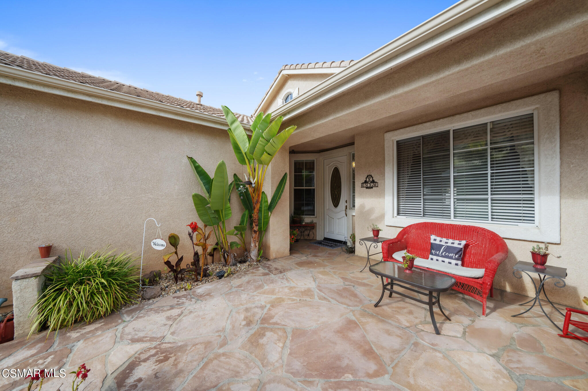 1990 Winterdew Avenue Simi Valley, CA 93065 - Photo 5 of 38 a backyard of a house with potted plants and couches