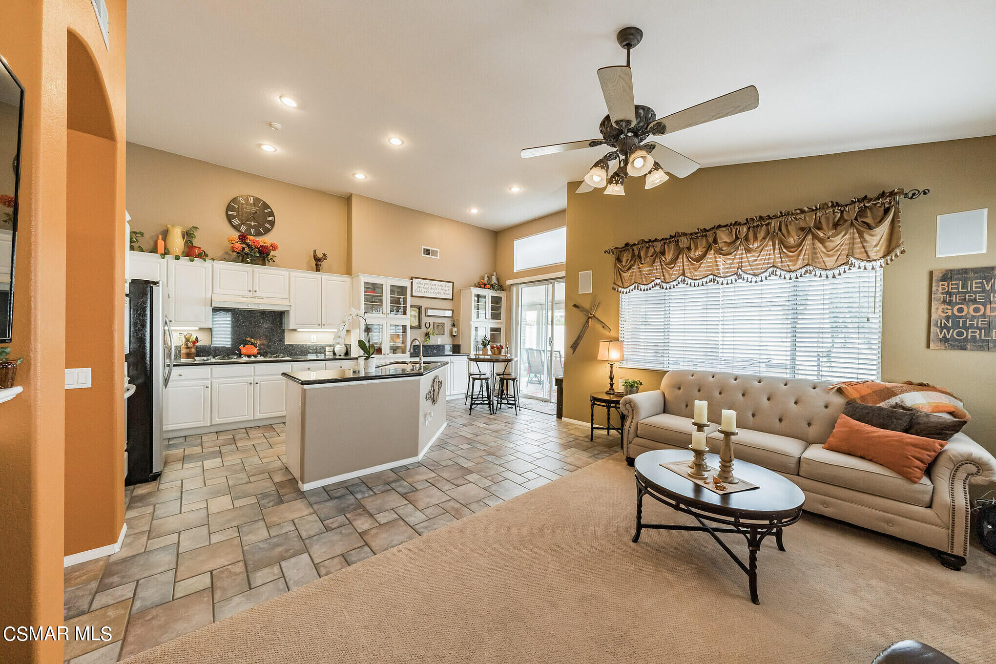 1990 Winterdew Avenue Simi Valley, CA 93065 - Photo 9 of 38 a living room with kitchen island furniture and a chandelier