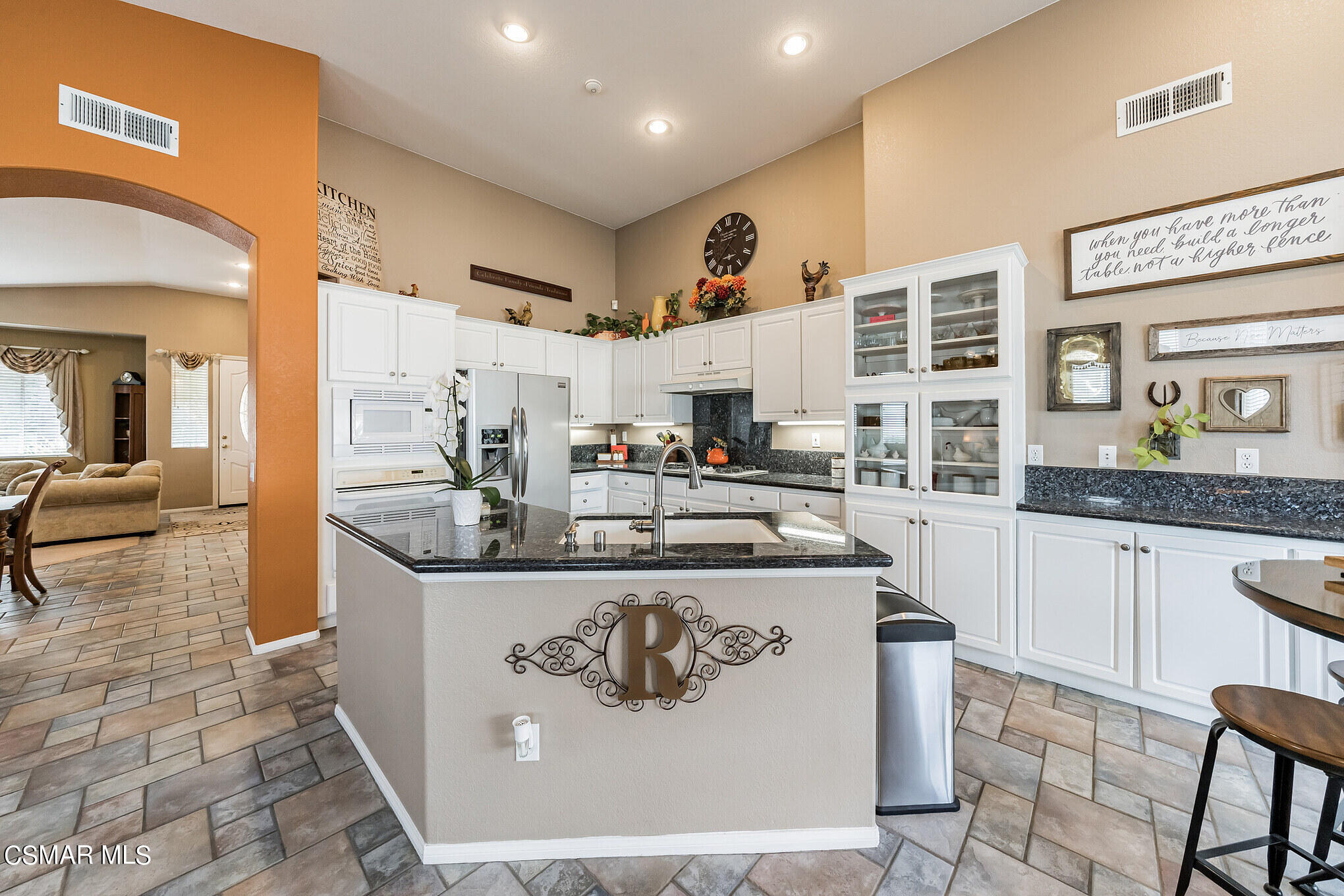 1990 Winterdew Avenue Simi Valley, CA 93065 - Photo 10 of 38 a kitchen with kitchen island stainless steel appliances a sink and counter space