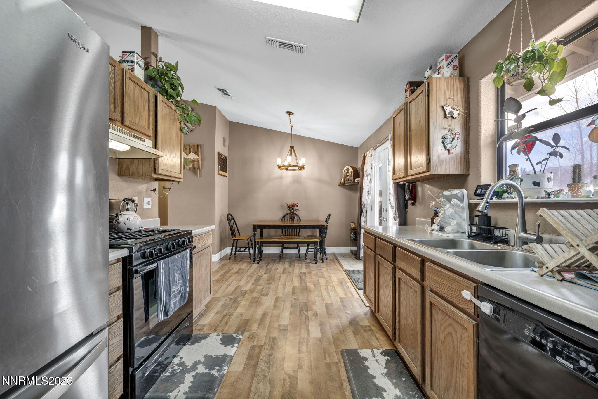 55 Buckboard Circle Reno, NV 89508 - Photo 11 of 39 a kitchen with granite countertop lots of counter top space and stainless steel appliances