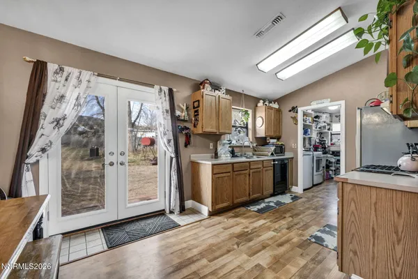 a kitchen with a refrigerator and a stove