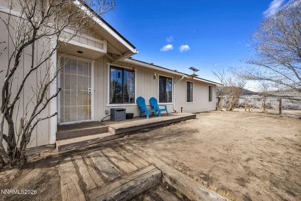 a view of a house with a snow on the road