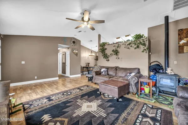 a living room with lots of furniture and a chandelier