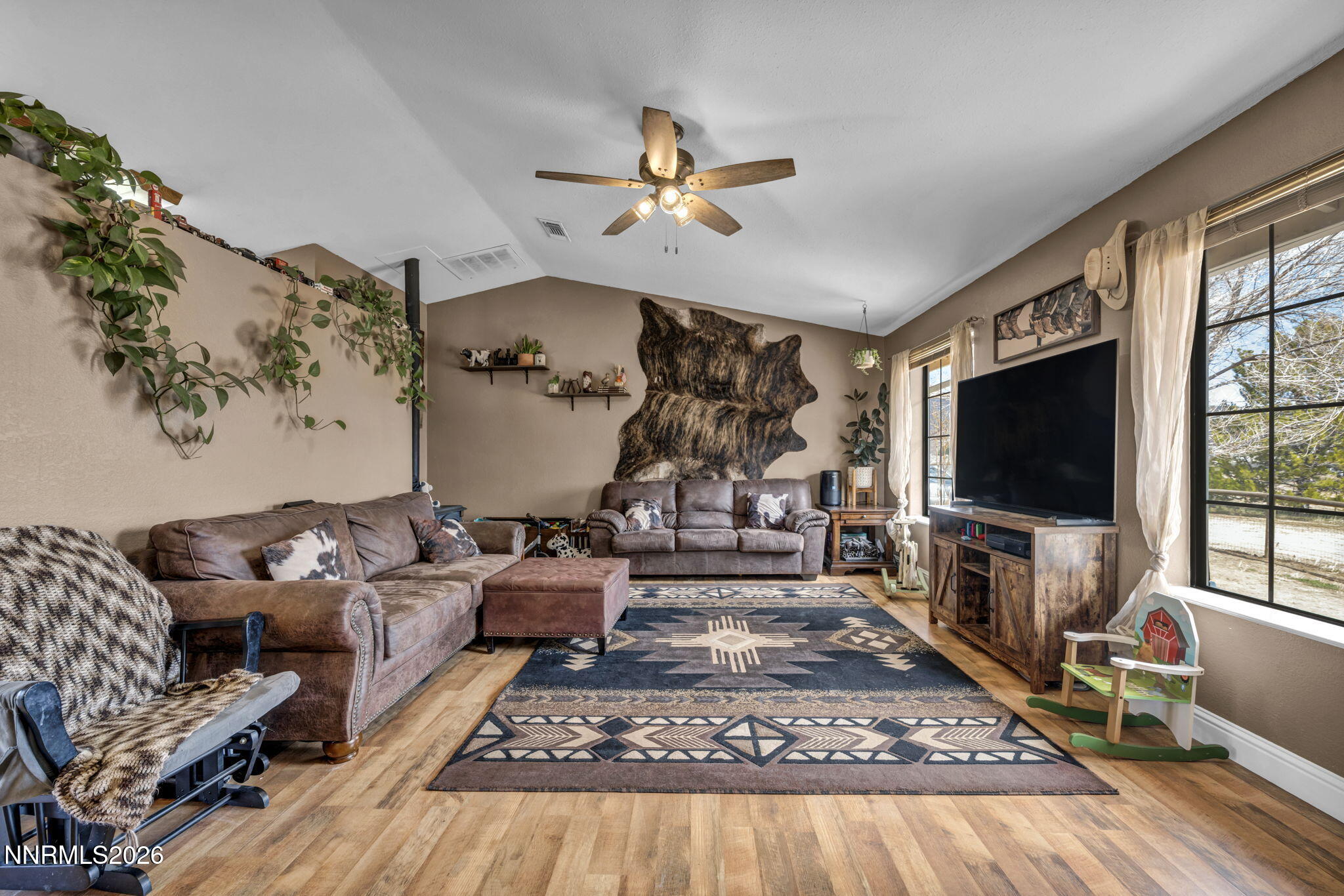 55 Buckboard Circle Reno, NV 89508 - Photo 6 of 39 a living room with furniture and a flat screen tv