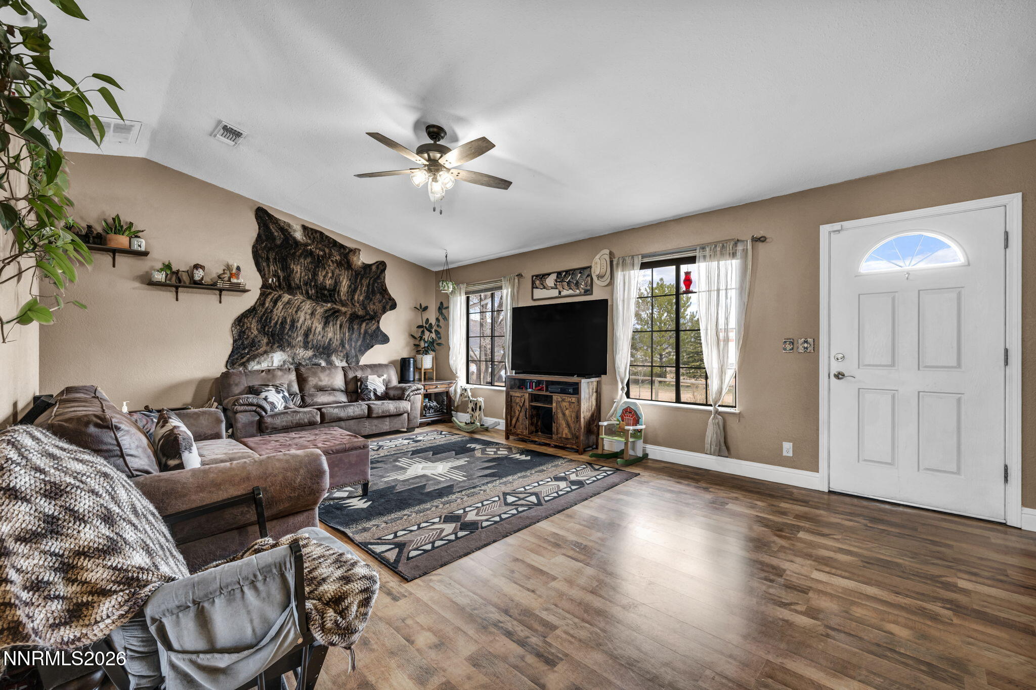 55 Buckboard Circle Reno, NV 89508 - Photo 8 of 39 a living room with furniture and a flat screen tv