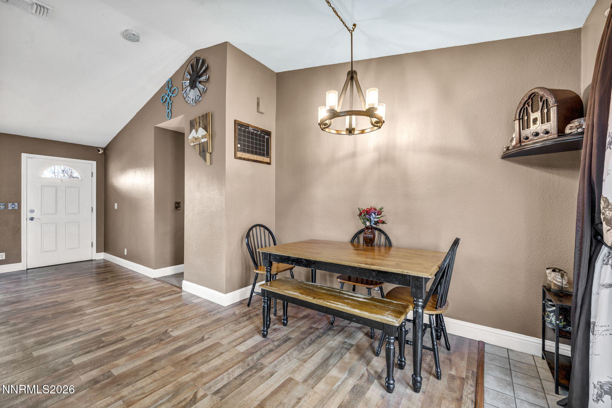 55 Buckboard Circle Reno, NV 89508 - Photo 9 of 39 a view of a dining room with furniture and wooden floor