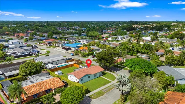 a view of a city with lots of residential buildings ocean and ocean view