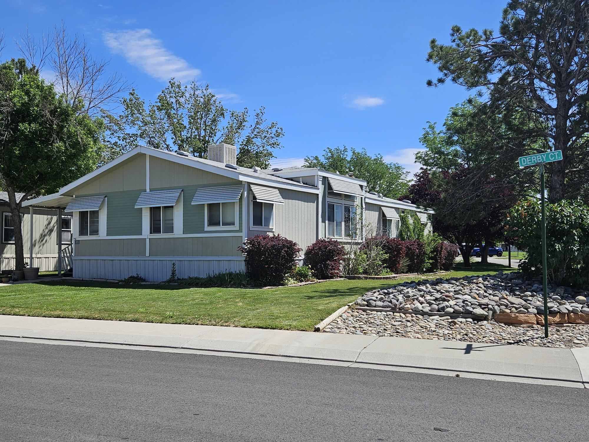 435 32 Road, Unit 424 Clifton, CO 81520 - Photo 2 of 21 a front view of a house with a yard